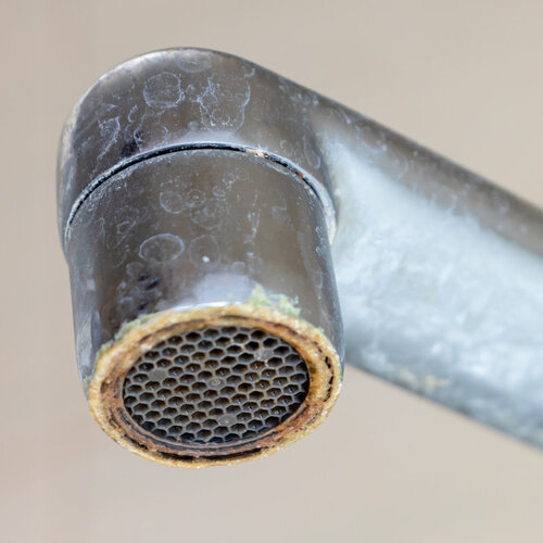 faucet rusted and calcified by hard water