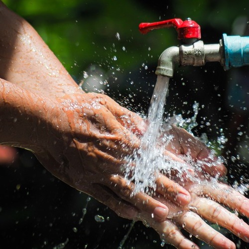 close-up of a person washing their hands